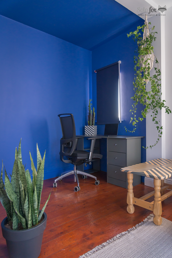 Renovated desk area with blue walls